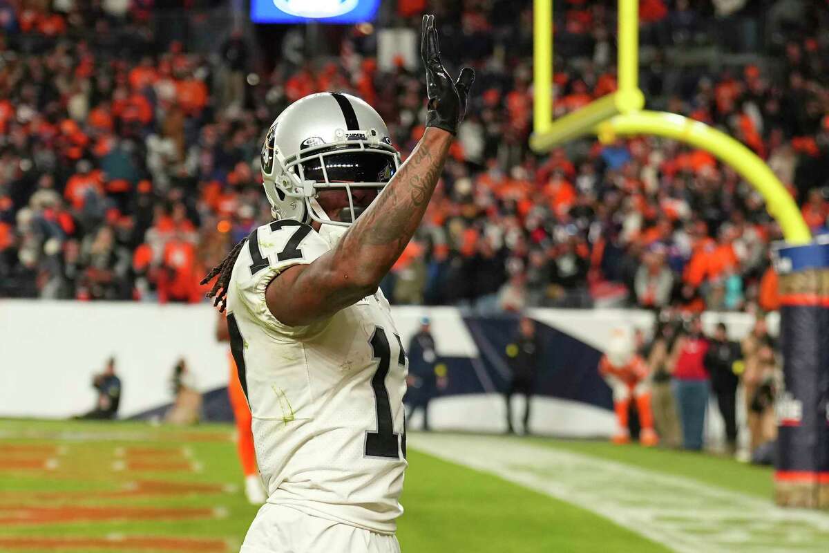 Raiders wide receiver Davante Adams celebrates after scoring the winning touchdown on a 35-yard play against the Broncos in overtime.