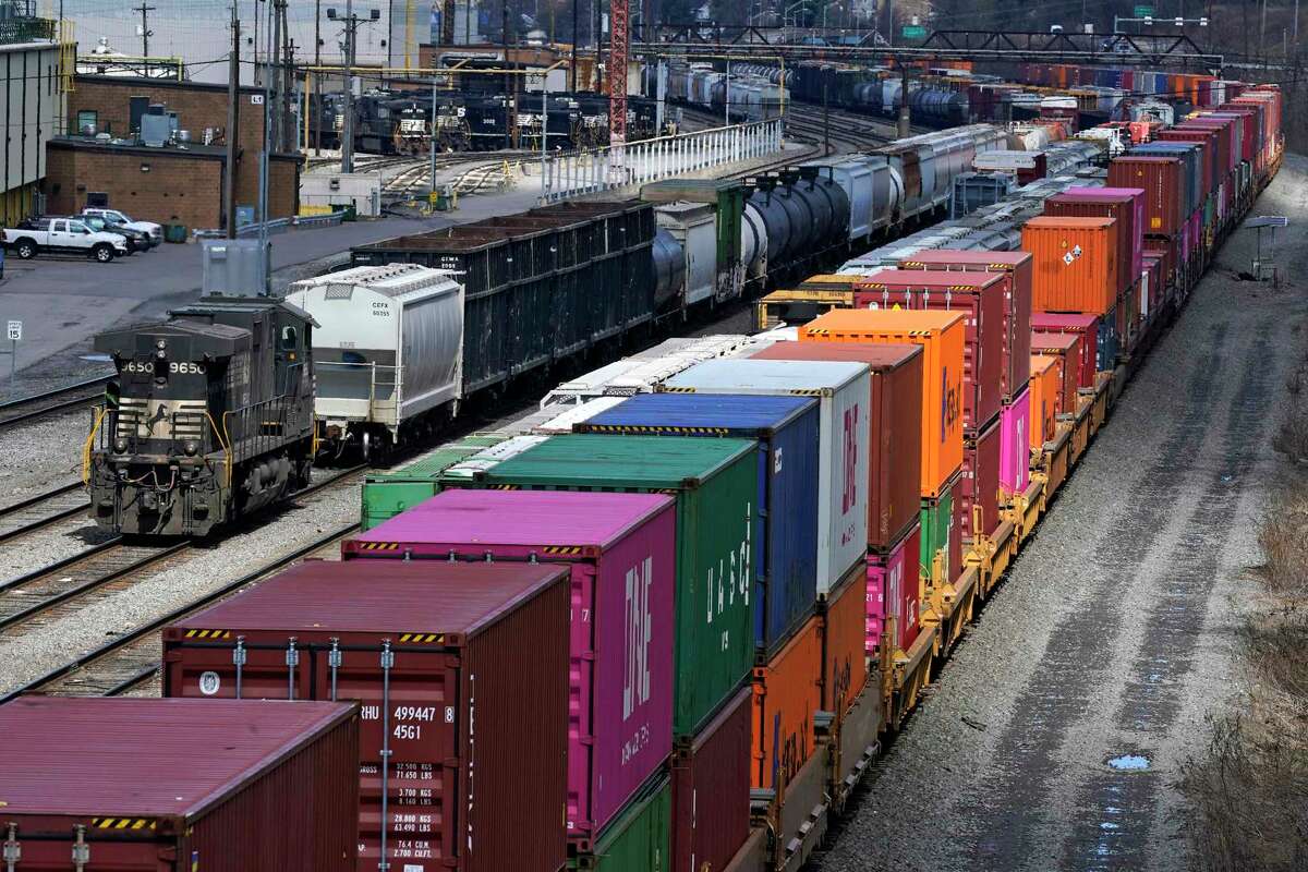 FILE - This April 2, 2021, file photo shows freight train cars and containers at Norfolk Southern Railroad's Conway Yard in Conway, Pa. Railroad engineers accepted their deal with the railroads that will deliver 24% raises but conductors rejected the contract casting more doubt on whether the industry will be able to resolve the labor dispute before next month’s deadline without Congress’ help. The votes, Monday, Nov. 21, 2022, by the two biggest railroad unions follows the decision by three other unions to reject their deals with the railroads that the Biden administration helped broker before the original strike deadline in September.