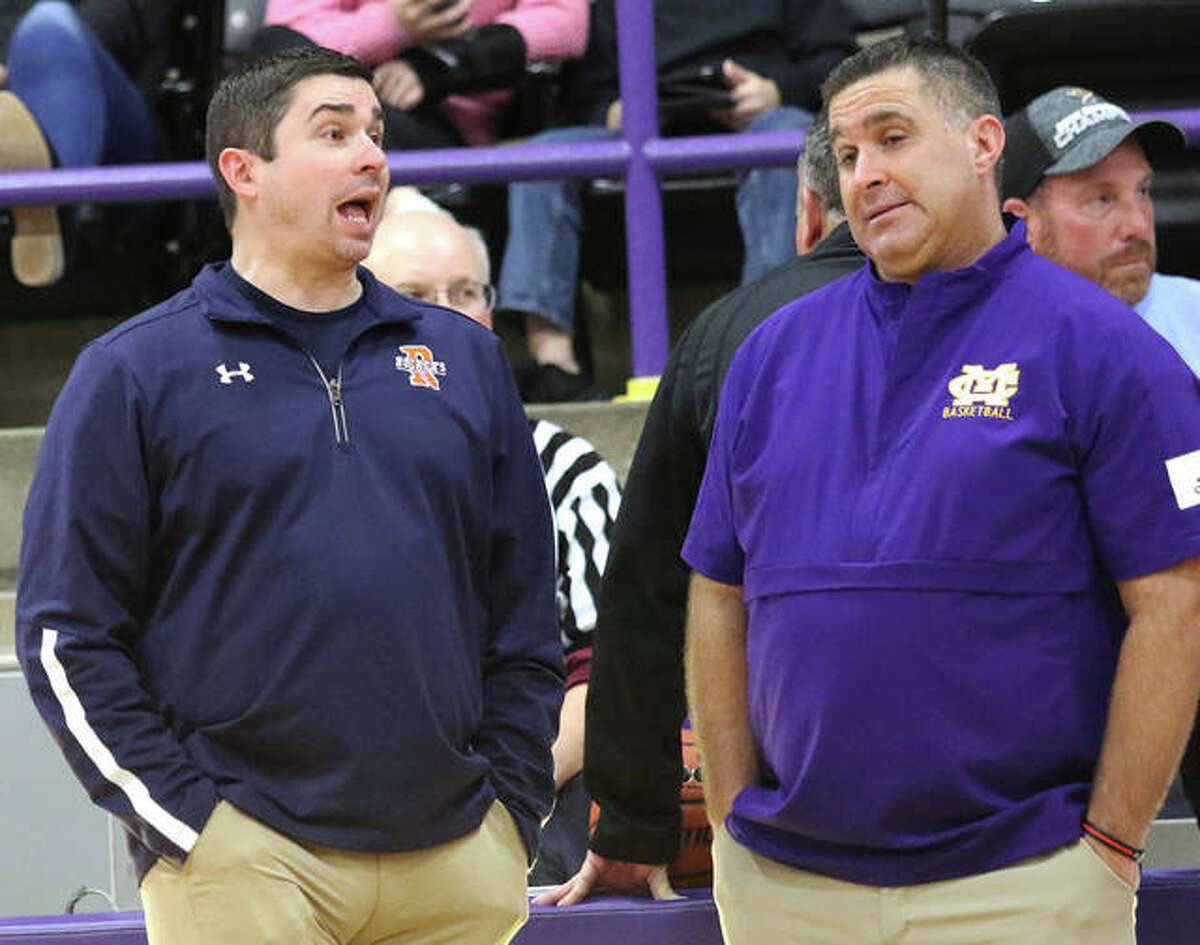 Rochester coach J.R. Boudouris (left) and CM coach Jonathan Denney talk at midcourt before the championship game at the 2019 Taylorville Thanksgiving Tournament.