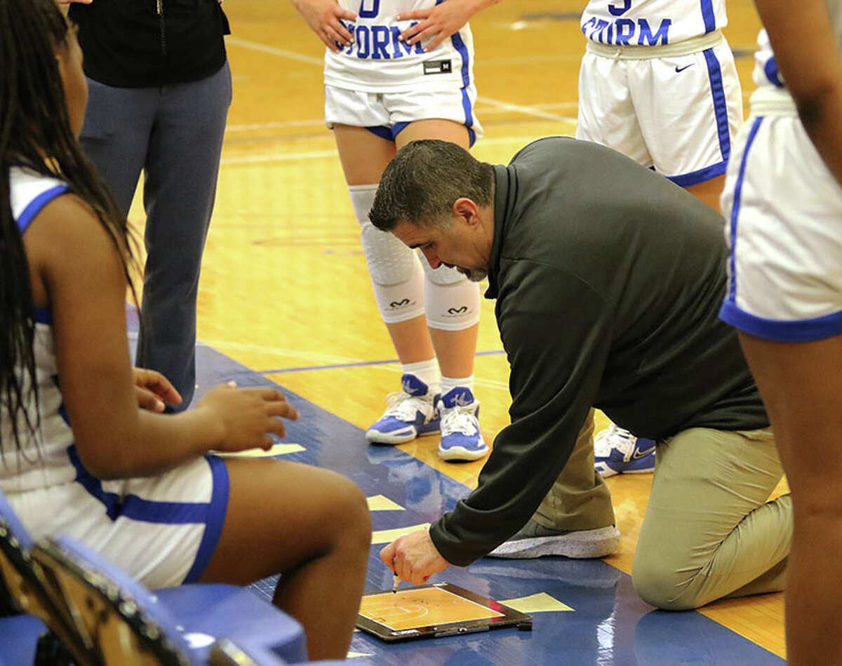 SWIC coach Jonathan Denney diagrams a play with his left hand during a timeout in a Nov. 16 game vs. LCCC in Belleville. Denney lost is right hand in a work accident in February 2020.