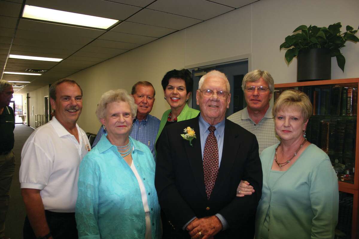 After Jess Parrish retired as MC’s second president, the college named the foyer of the Davidson Health Sciences Center in his honor. Parrish (front, center) is surrounded by several Health Sciences faculty and administrators.  All of these people have now retired from MC. Front row left to right: Celia Harris, Jess Parrish (deceased and Rita Stotts. Back row left to right: William Heathman, Wayne Holcomb (deceased), Eileen Piwetz and Quinn Carroll.