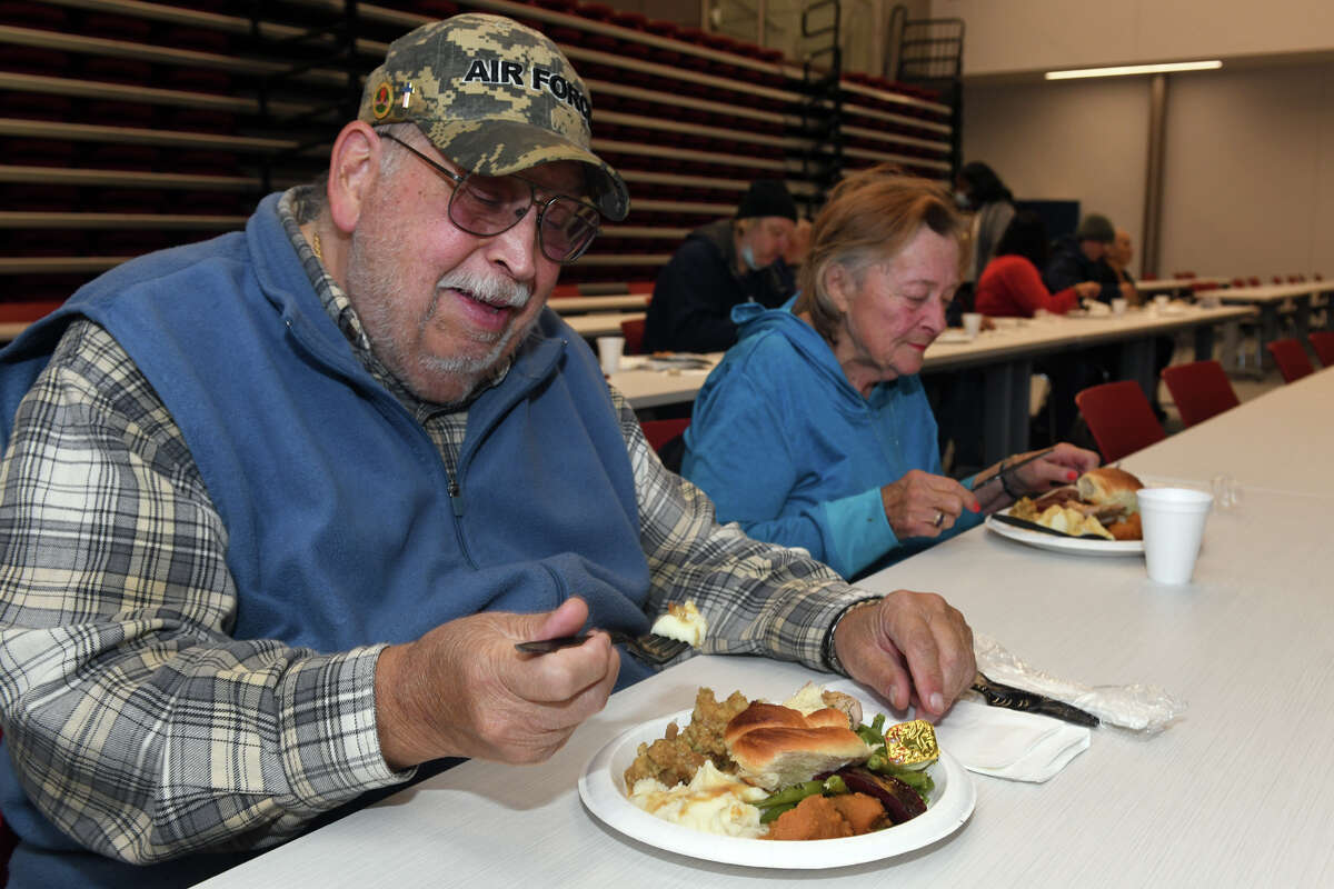 Carl and Sharon Raytar, of Milford, enjoy a Thanksgiving lunch prepared by the culinary arts students at Platt Technical High School, in Milford, Conn. Nov. 21, 2022.