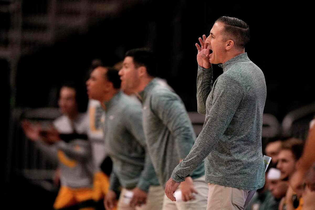 San Francisco head coach Chris Gerlufsen talks to his players during the first half of an NCAA college basketball game against Northern Iowa in the Hall of Fame Classic, Monday, Nov. 21, 2022, in Kansas City, Mo. (AP Photo/Charlie Riedel)