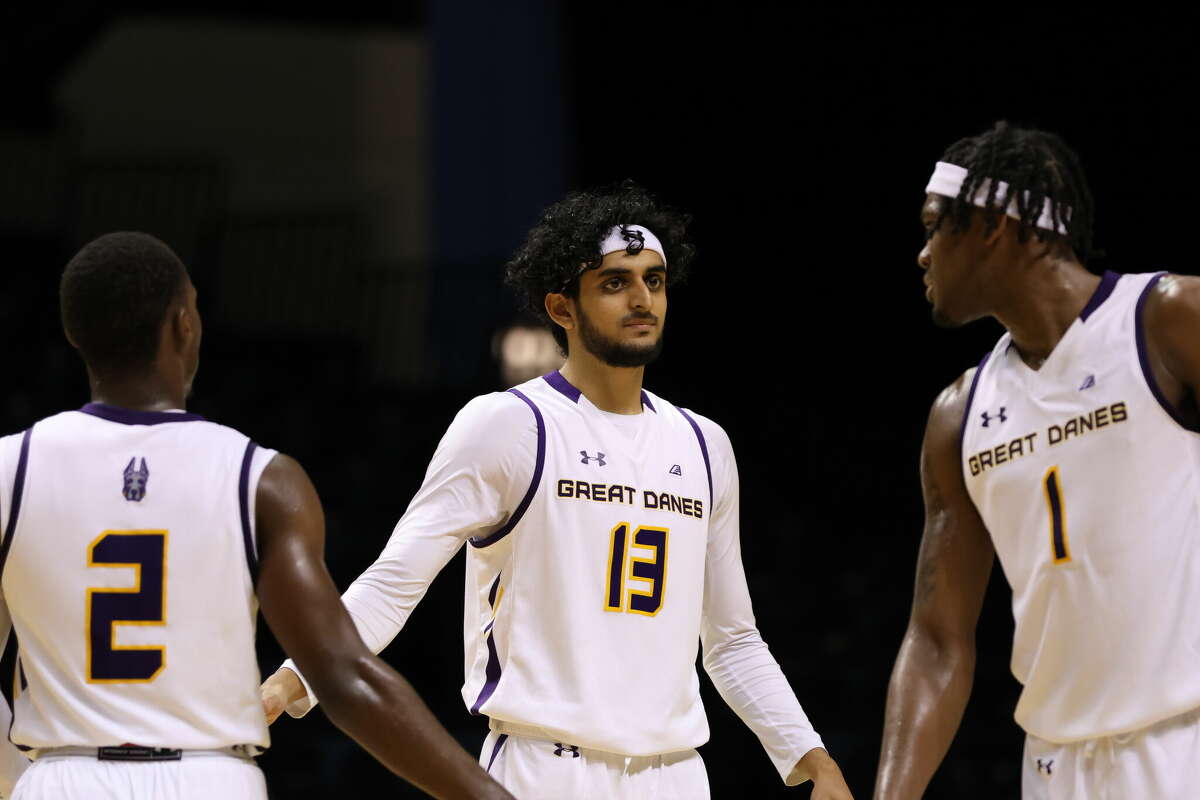 UAlbany fifth-year guards Da'Kquan Davis (2) and Sarju Patel (13) and senior guard Gerald Drumgoole Jr. (1) during a break in game action against Austin Peay in the first game of the Sunshine Slam tournament in Daytona Beach, Fla., on Monday, Nov. 21, 2022. The Great Danes won their second game of the tournament against Presbyterian.