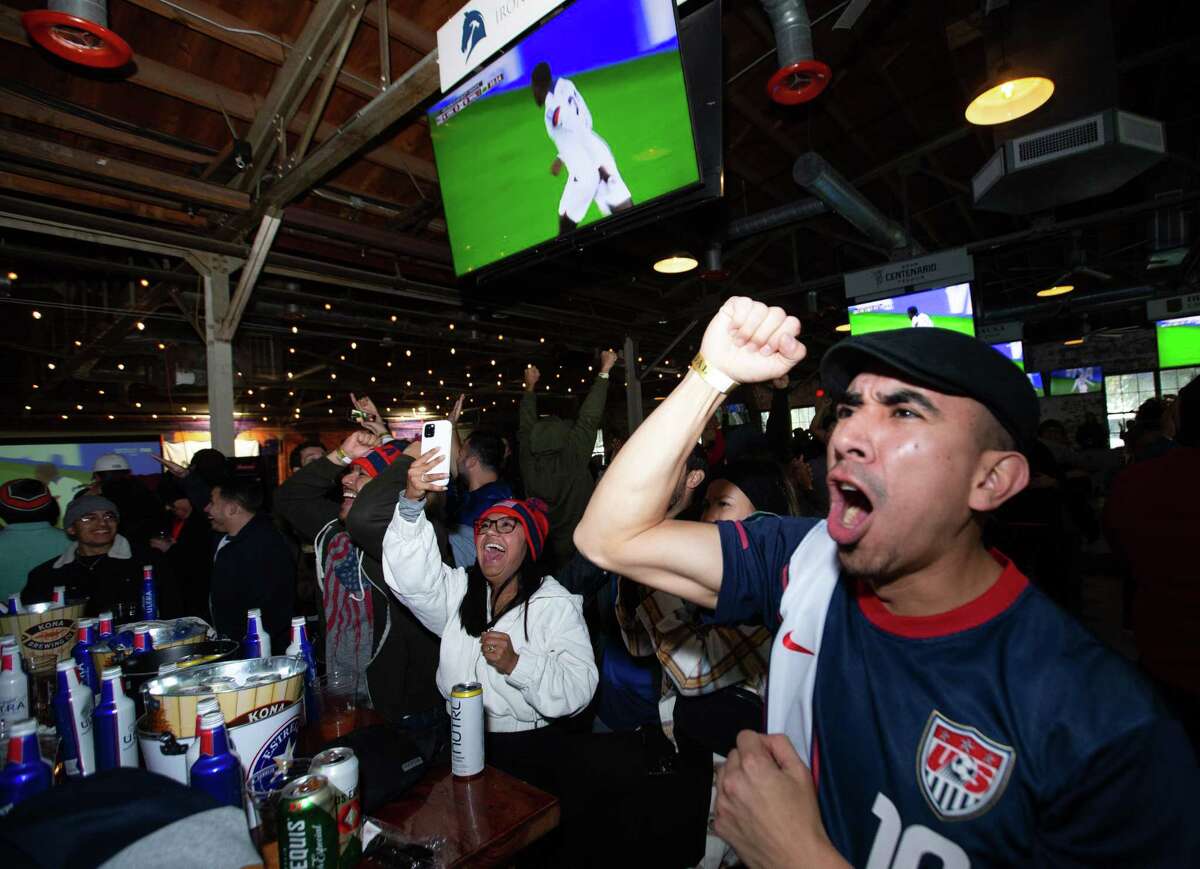USA fans celebrate the Timothy Weah goal at the 36th minute of the World Cup match against Wales Monday, Nov. 21, 2022, at Pitch 25 in Houston.