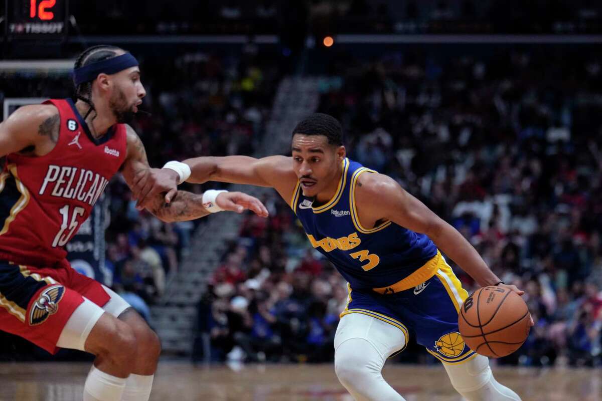 Golden State Warriors guard Jordan Poole (3) drives to the basket against New Orleans Pelicans guard Jose Alvarado (15) in the second half of an NBA basketball game in New Orleans, Friday, Nov. 4, 2022. The Pelicans won 114-105. (AP Photo/Gerald Herbert)