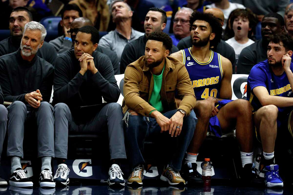 NEW ORLEANS, LOUISIANA - NOVEMBER 21: Stephen Curry #30 of the Golden State Warriors sits on the bench during the second quarter of an NBA game at Smoothie King Center on November 21, 2022 in New Orleans, Louisiana. NOTE TO USER: User expressly acknowledges and agrees that, by downloading and or using this photograph, User is consenting to the terms and conditions of the Getty Images License Agreement. (Photo by Sean Gardner/Getty Images)