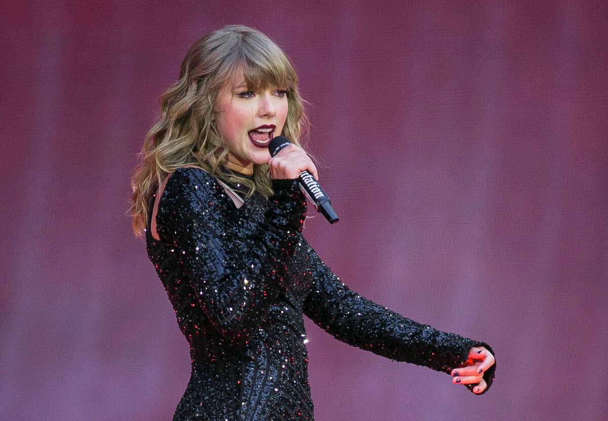 FILE - Singer Taylor Swift performs on stage in a concert at Wembley Stadium on June 22, 2018, in London. On the heels of a messy ticket roll out for Swift’s first tour in years, fans are angry; they’re also energized against Ticketmaster. While researchers agree that there’s no way to tell how long the energy could last, the outrage shows a way for young people to become more politically engaged through fan culture. (Photo by Joel C Ryan/Invision/AP, File)