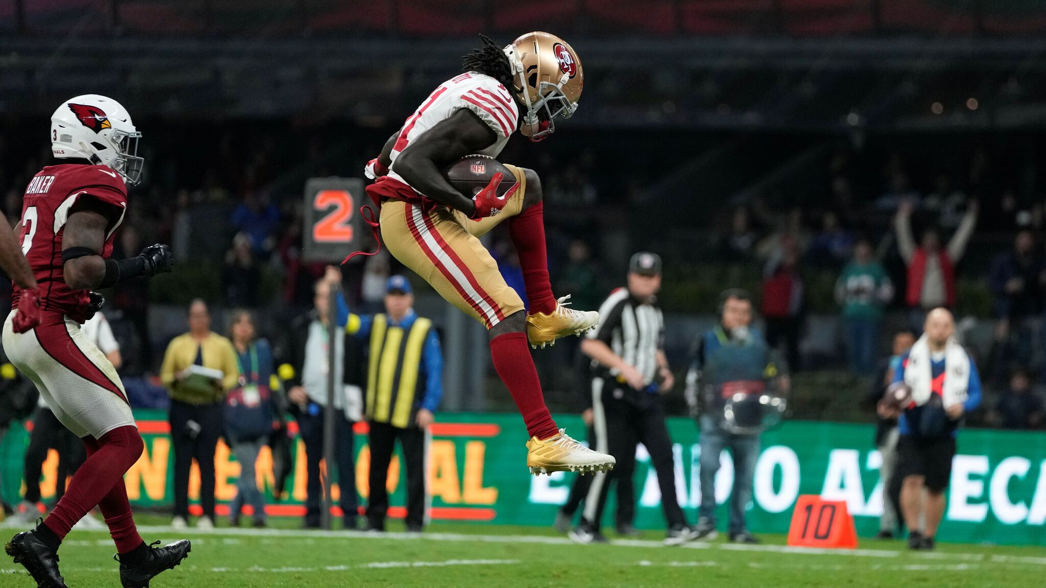 Santa Clara, California, USA. 18th Oct, 2020. San Francisco 49ers wide  receiver Brandon Aiyuk (11) celebrates touchdown with team member in front  of TV screen on Sunday, October 18, 2020, at Levis