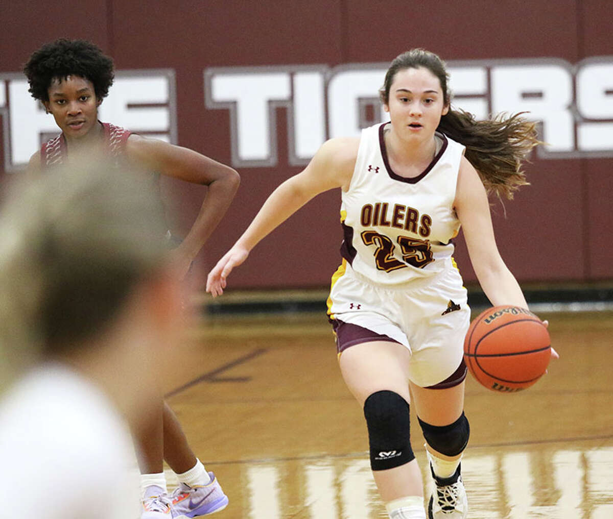 EA-WR's Milla LeGette (right) pushes the ball upcourt against Waterloo Gibault in Saturday's title game at the Dupo Cat Classic. On Monday night, LeGette scored 10 points in the Oilers win at New Athens.