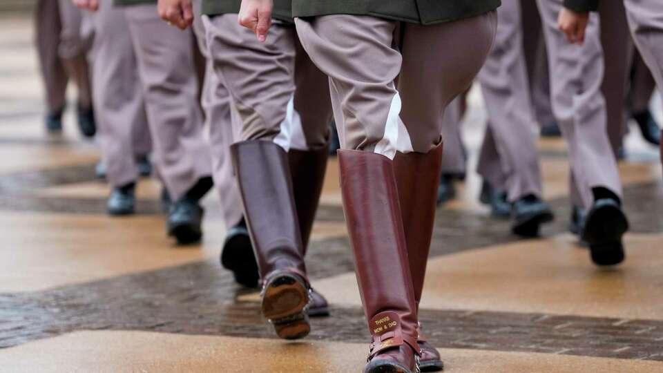 A thank you message is shown on a pair of senior boots as the Texas A&M University Corps of Cadets march to Veterans Review on Saturday, Nov. 19, 2022 in College Station. Texas A&M University's Corps of Cadets is amid a campaign to grow the organization to 3,000 members by 2030. At more than 2,100 members this year, the Corps is already the largest uniformed student body in the nation outside of the military academies.