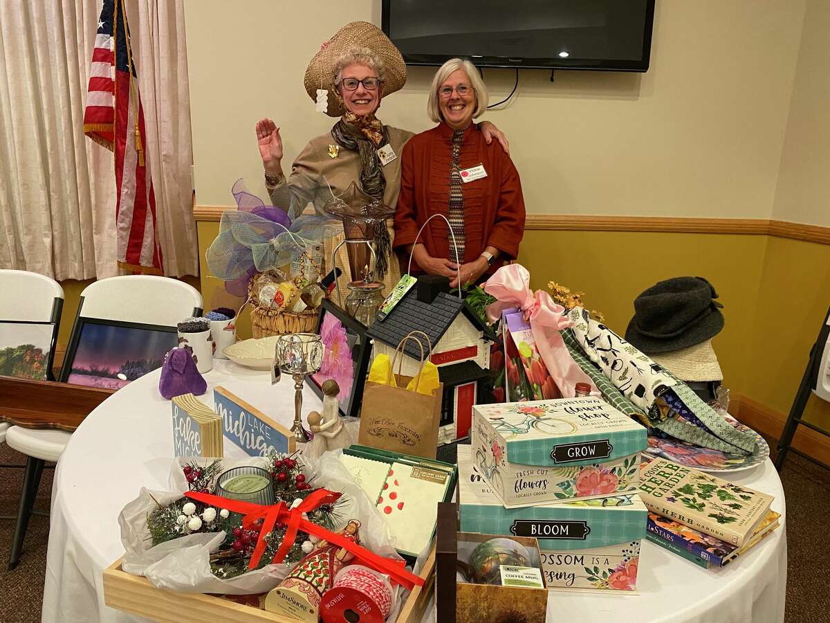 Spirit of of the Woods Garden Club members Kathy Stefanski and Vickie Johnson were the auctioneers at the annual auction and potluck on Nov. 14.