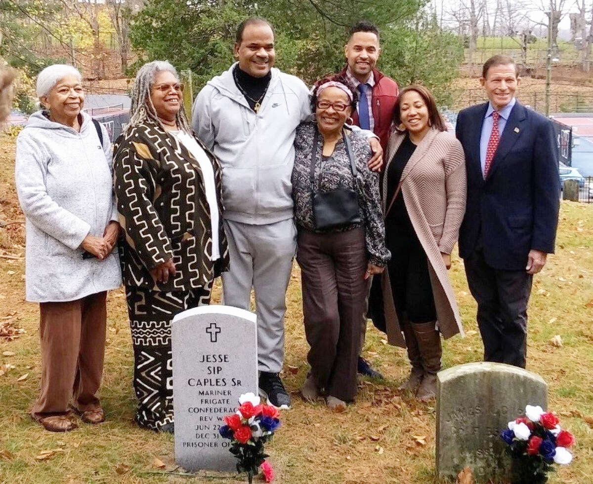 African-American Middletown Revolutionary War veteran Jesse Caples served in Continental Frigate Confederacy in 1779. His descendants met at Caples' final resting place, the Washington Street cemetery, on Nov. 11. From left are Barbara Strong Wiggins and Betty Ann Rooks, both of Hartford; Frank Reese of Bridgeport, and Todd Russell and Savone Russell, both of Hartford.