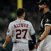 Jose Altuve #27 of the Houston Astros talks with Jose Abreu #79 of the Chicago White Sox during a pitching change in the second inning during game 3 of the American League Division Series at Guaranteed Rate Field on October 10, 2021 in Chicago, Illinois.