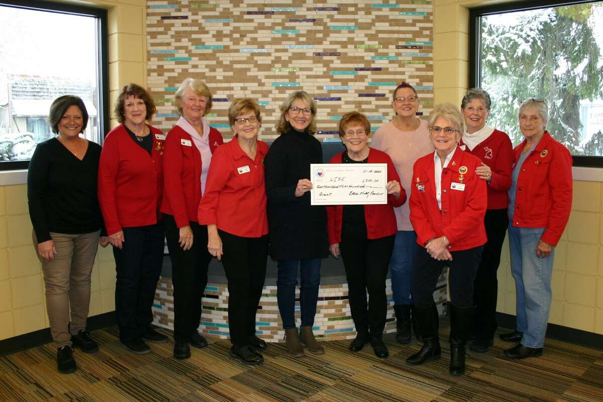 The General Federation of Women's Club Mecosta Heart of the Lakes chapter presented nine local nonprofits with grants recently. Director Jane Currie (center) accepts a check on behalf of WISE.