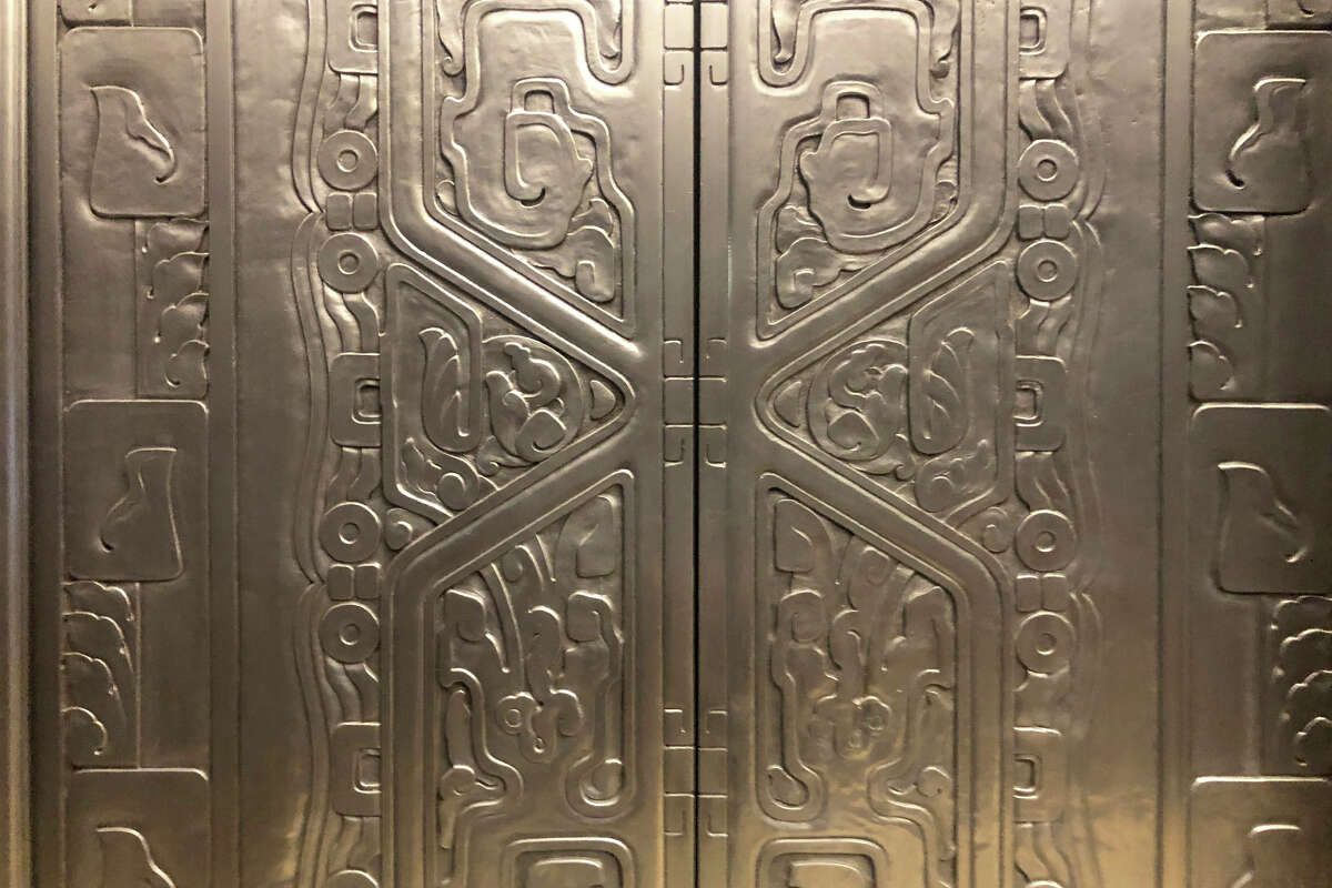 A detail view an elevator door ornate  inside the lobby of 450 Sutter St. in downtown San Francisco.