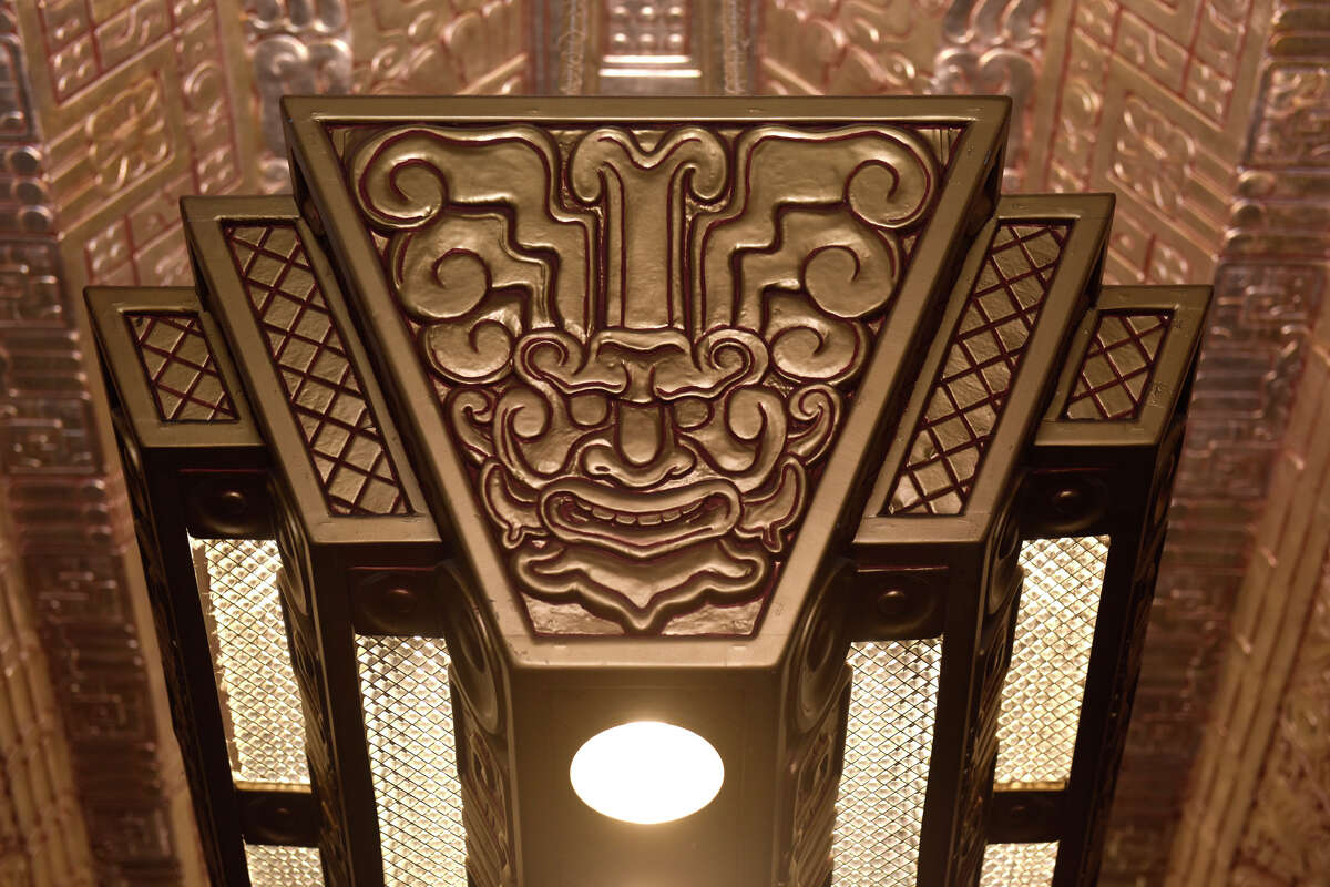 One of the ornate light fixtures inside the lobby of 450 Sutter St. which boasts an intricate Mayan-inspired design. 