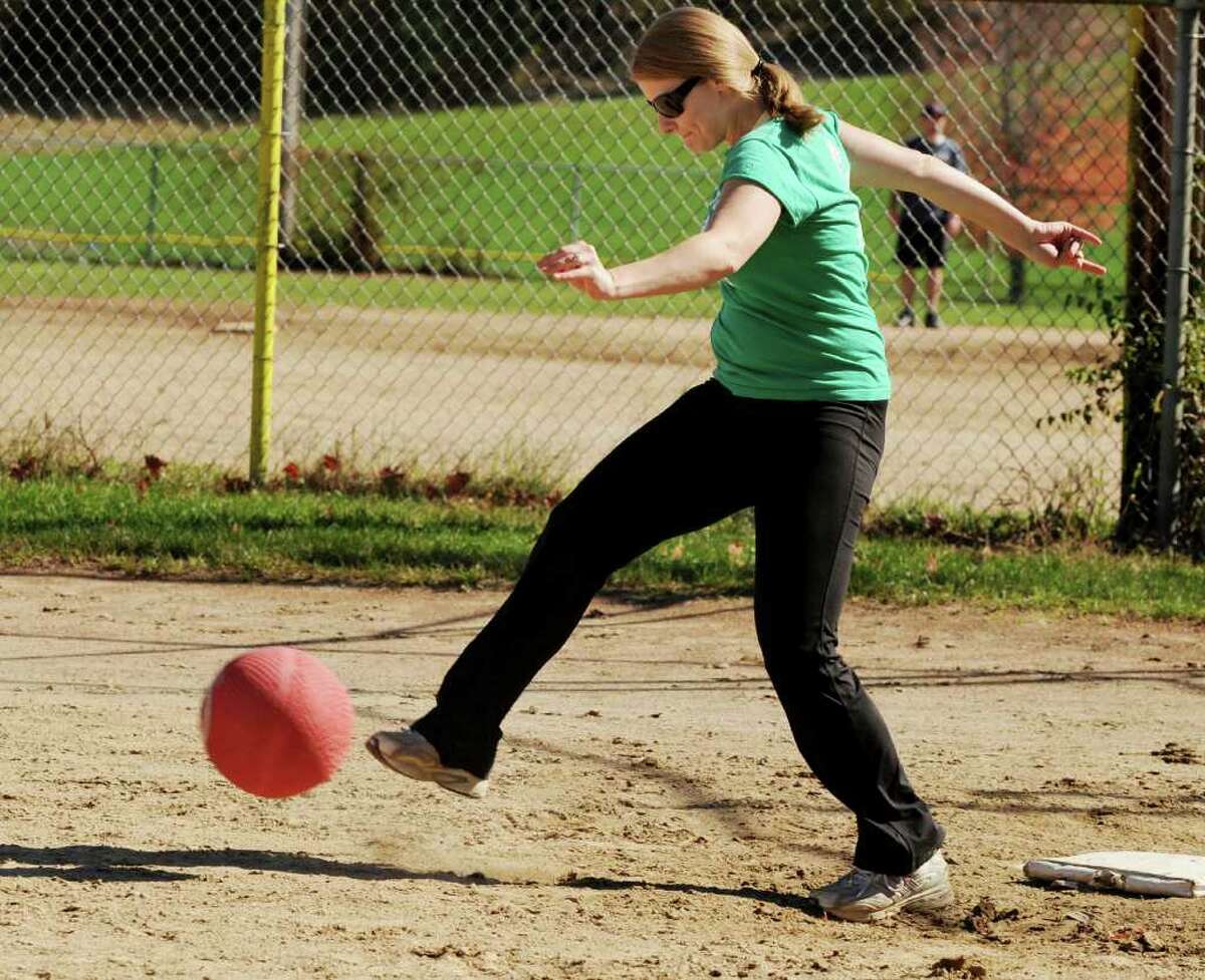 Danielle Mazzariello, first baseman for Netter's Team, kicks the pitch from the Cleats and Cleavage Team at the Kickball Tournament to support Netter's Fund at Knickerbacker Park in Lansingburgh on Sunday, Oct. 10, 2010. (Luanne Ferris / Times Union)