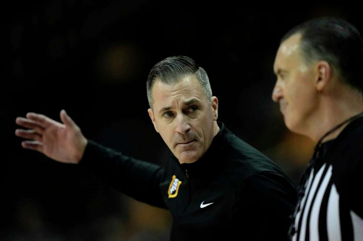 San Francisco head coach Chris Gerlufsen talks to an official during the first half of an NCAA college basketball game against Wichita State in the Hall of Fame Classic, Tuesday, Nov. 22, 2022, in Kansas City, Mo. (AP Photo/Charlie Riedel)
