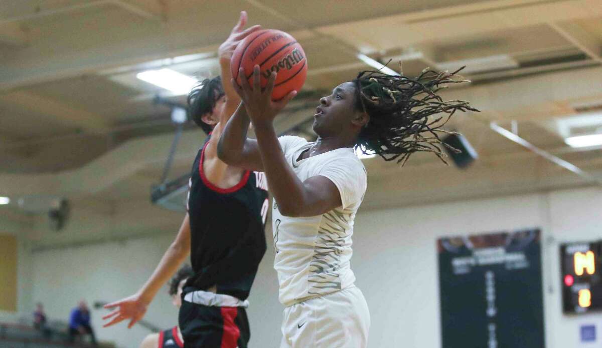 Conroe’s Tavi Warren (1) is fouled as he shoots in the first quarter of a non-district high school basketball game at Conroe High School, Tuesday, Nov. 22, 2022, in Conroe.