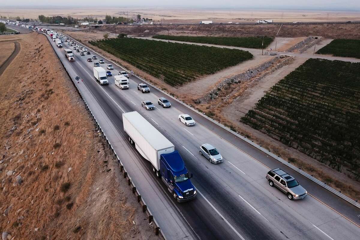 An aerial picture shows trucks, cars and other vehicles sitting in traffic on Interstate 5 in Kern County, Calif.