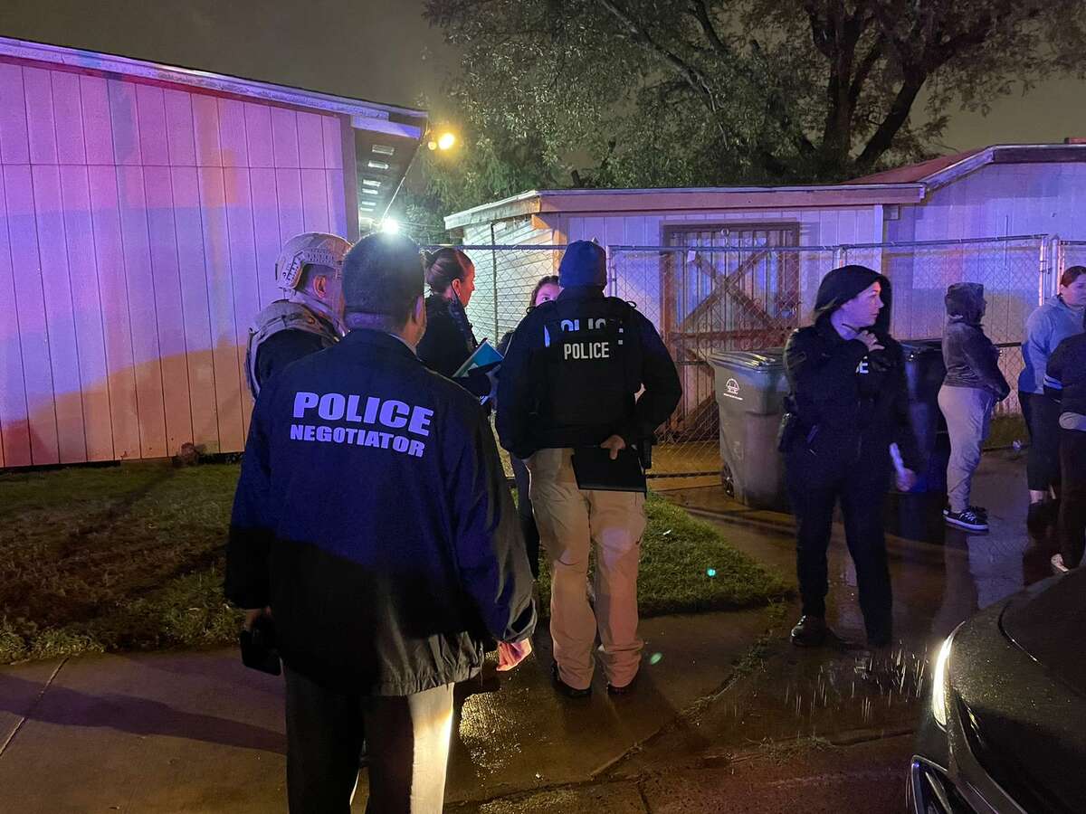 Laredo police officers and negotiators are seen at the scene of a barricaded person in the 100 block of East San Pedro Street. It is alleged that the barricaded individual discharged a firearm.