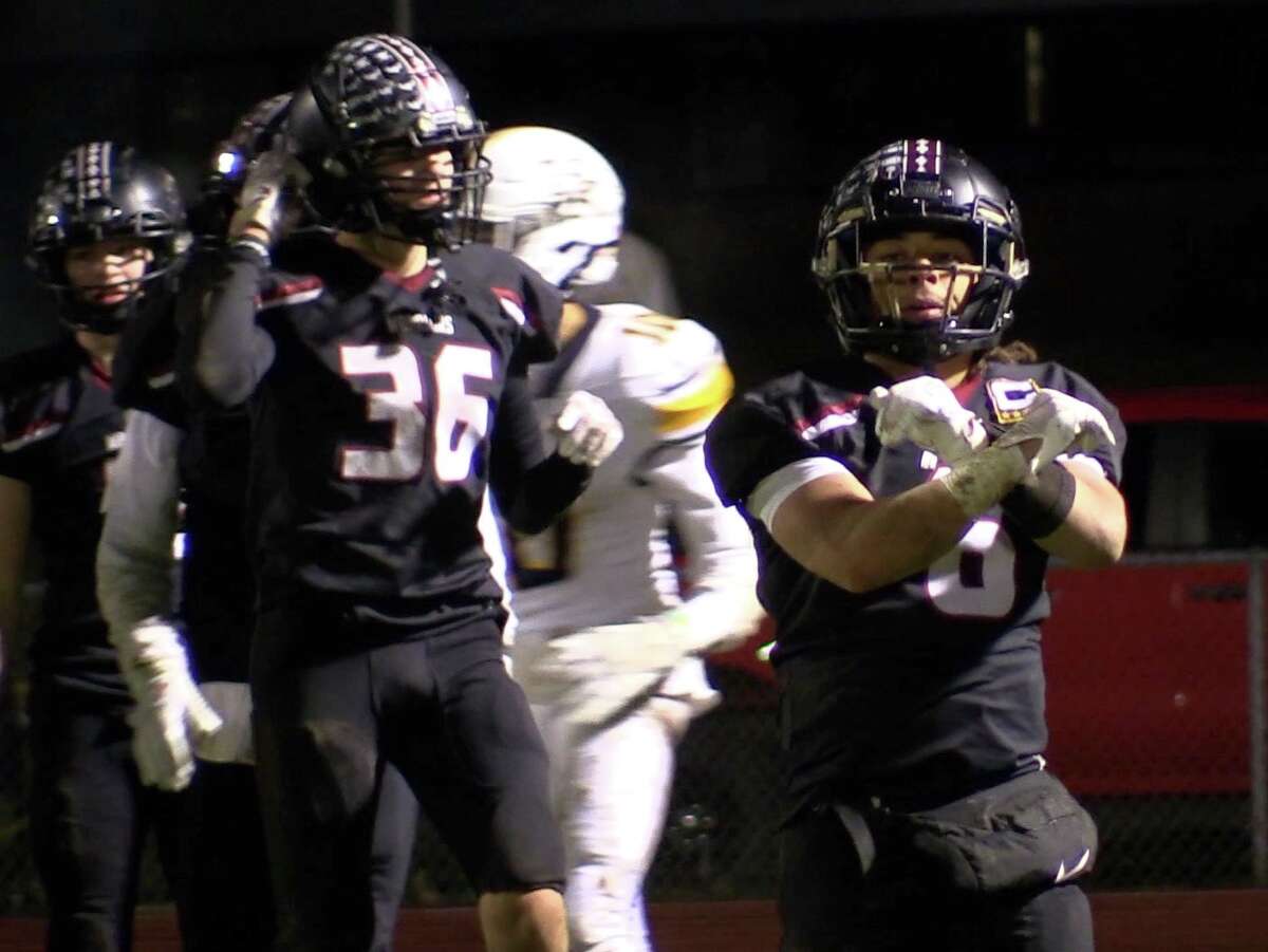 Valley Regional/Old Lyme's Di'Angelo Jean-Pierre celebrates making a defensive stop before halftime during Valley Regional/Old Lyme's 28-8 win over Haddam-Killingworth HS in Higganum, Tuesday, Nov. 22, 2022