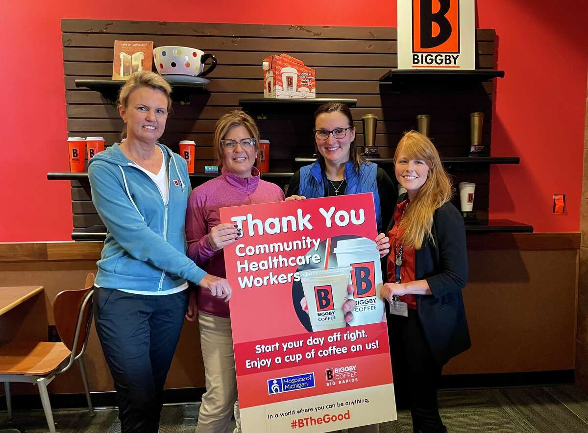 Biggby Coffee owners Tammy Lewandowski (far left) and Julie Denslow (second to far left) pose for a photo with Hospice of Michigan representatives Danielle Knight  (second to far right) and Cassandra Haner (far right) as the organization honored the coffee shop's support of healthcare workers.