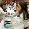 Nicole Orlofsky gathers finished Thanksgiving meals together during Temple Sholom's annual Teen Thanksgiving Cooking program in Greenwich, Conn., on Tuesday November 22, 2022. Eighth through twelfth graders, who are members of the Judah BBYO chapter at Temple Sholom, gathered to prepare more than 100 meals for those in our Greenwich community who are less fortunate or homebound.