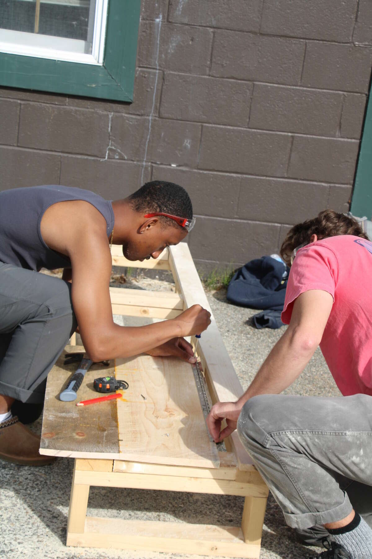 Paul Smith's College students work on the mobile cultural center that will bring Mohawk-language books throughout Akwesasne land.