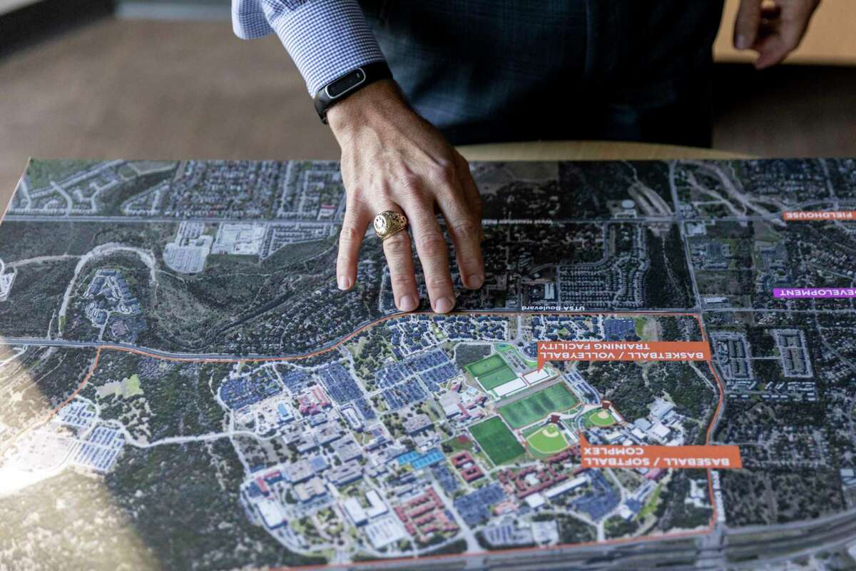 Andrew Hunt, vice president of Project Control, points out details in construction plans at the University of Texas at San Antonio’s main campus.