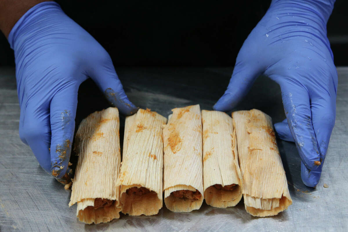 Juan Rodriguez demonstrates how he makes tamales at Tamale Boy Tacos and Tamales.