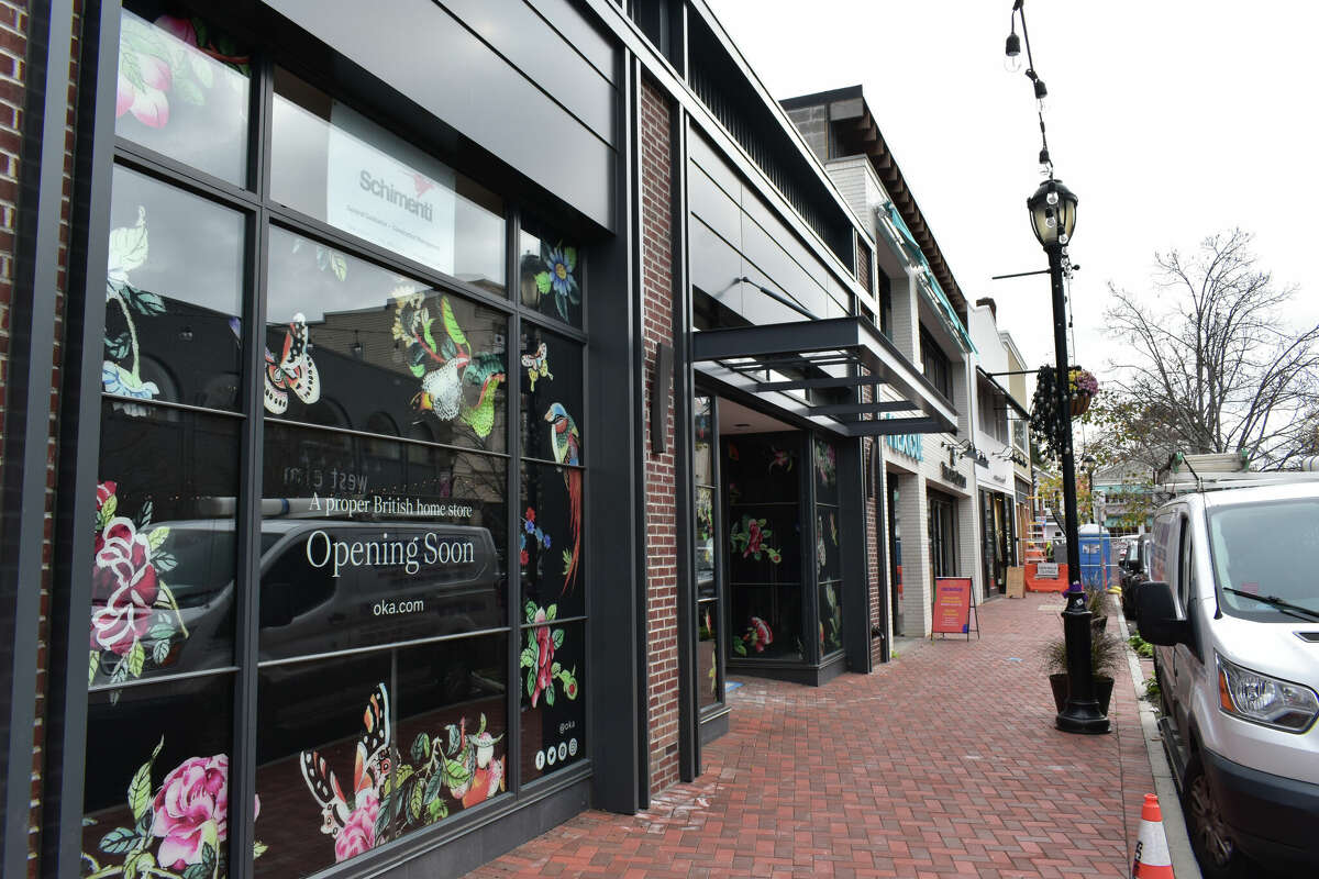 The storefront for Oka being fitted out on Main Street in Westport, Conn., in November in advance of Black Friday. After a boom real estate market during the COVID-19 pandemic, retailers have followed with only about one in every 15 storefronts downtown lacking occupants.