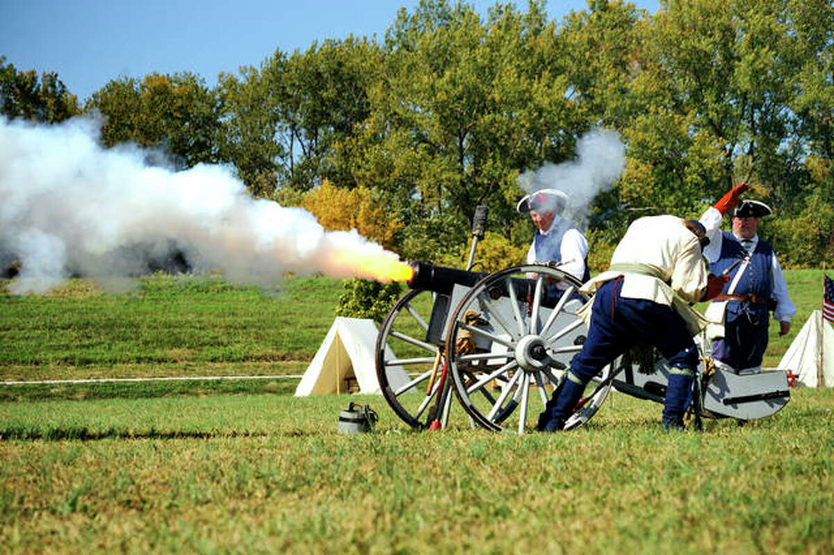 Reenactors fire a cannon during a previous Point of Departure Weekend at the Lewis and Clark State Historic Site in Hartford. The 219th anniversary of the Lewis and Clark Expedition’s arrival at their Illinois winter encampment will be celebrated Dec. 10-11.