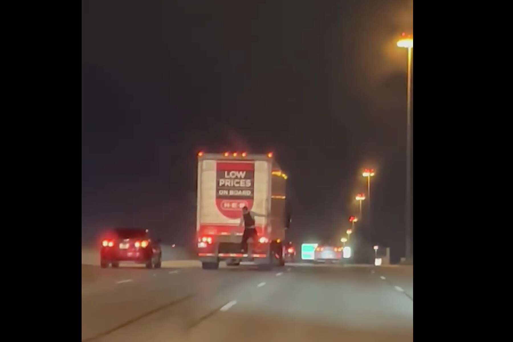Man filmed gripping back of H-E-B 18-wheeler on Texas highway
