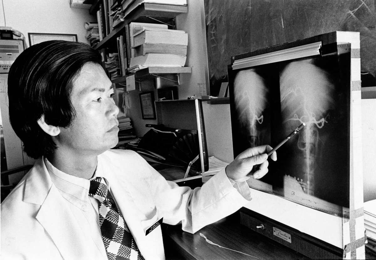 Dr. Vu Ban, a plastic surgeon, is shown working on a radiology research project at the University of Texas MD Anderson Cancer and Tumor Institute, photographed in August 1975. Dr. Ban and his family are refugees from Vietnam who moved to Houston.