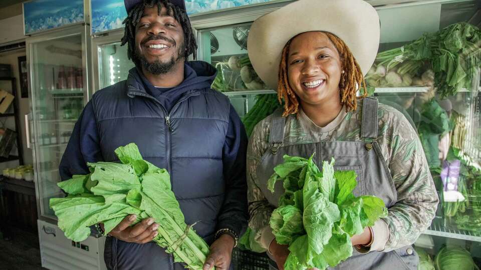 Urban farmers, Jeremy Peaches of Fresh Life Organics & Ivy Lawrence-Walls of Ivy Leaf Farms, who also are the founders of Black Farmer Box, soft open their first grocery store in Sunnyside on Tuesday November 23, 2022.