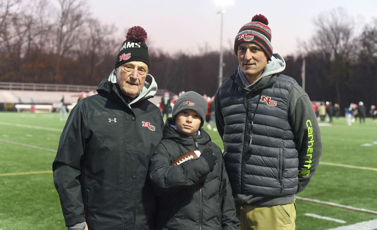 The Silvestris, from left, John, Charlie and Chris, during New Canaan football practice at Dunning Field on Monday, Nov. 21, 2022.