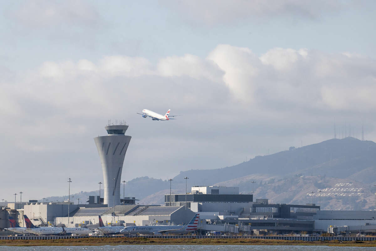 A takeoff behind the air traffic control tower at SFO in September 2022.