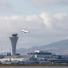 A take off behind the air traffic control tower at SFO in September 2022.