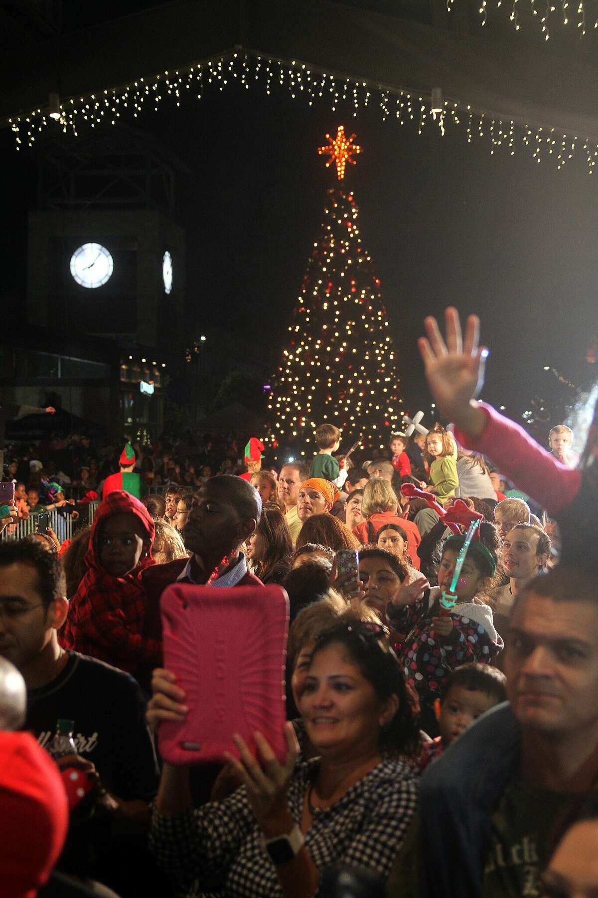 Thousands gather to watch the annual tree lighting ceremony during the Annual Hometown Christmas Festival at Pearland Town Center. This year's event is on Nov. 26.
