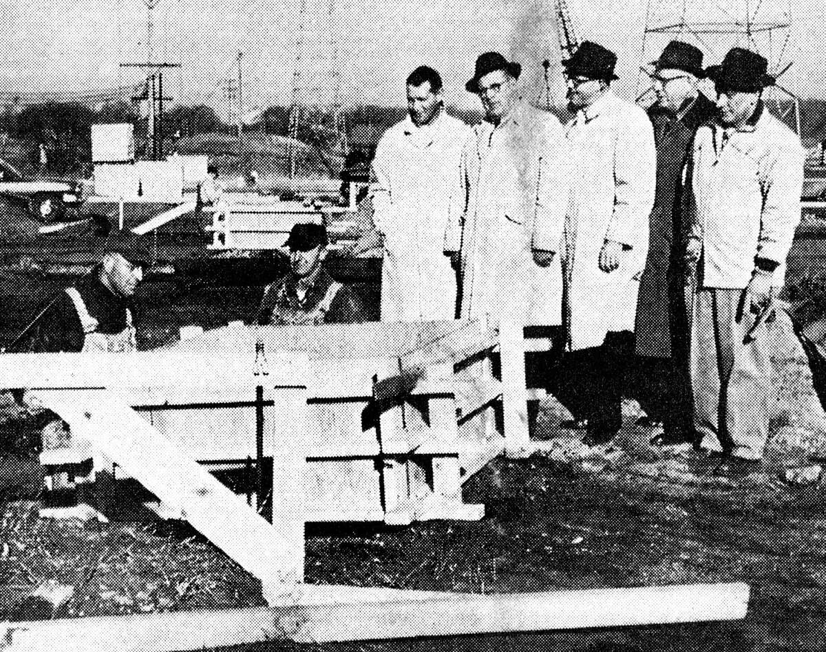 With the weather cooperating, progress is being made on the addition to the machine shop at the Manistee Iron Works. (From left) Sylvester "Buck" Flarity, vice president of the Industrial Development Corporation of Manistee; Norman Synnestvedt, general manager of the Manistee Iron Works; Sam Henry, secretary and manager of Manistee County Board of Commerce; Edwin Hokanson, IDC president and Bob Doughery, superintendent of Cunningham & Limp, building contractors watch a form being put in place this morning. The photo was published in the News Advocate on November 26, 1962.