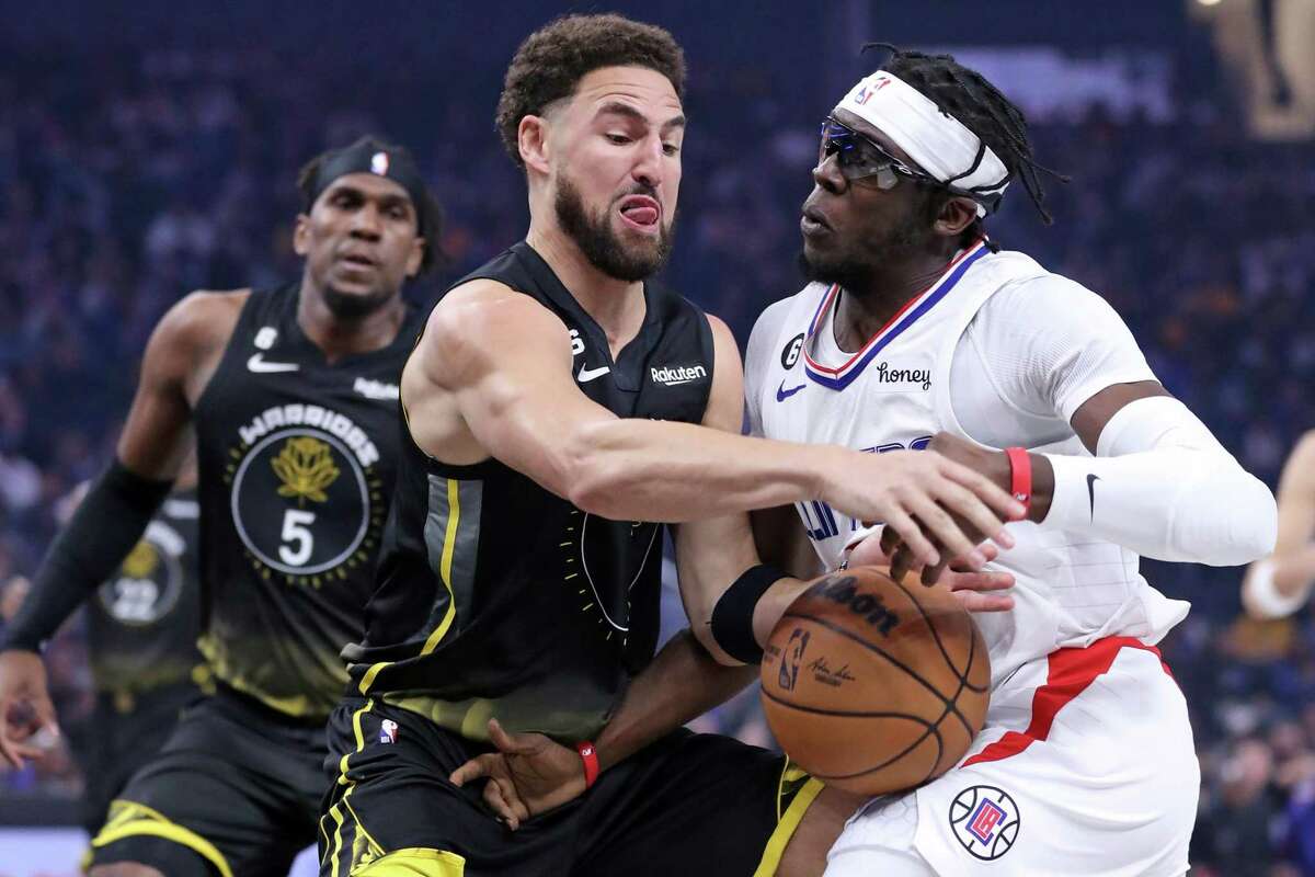 Golden State Warriors’ Klay Thompson steals the ball from Los Angeles Clippers’ Reggie Jackson in 1st quarter during NBA game at Chase Center in San Francisco, Calif., on Wednesday, November 23, 2022.