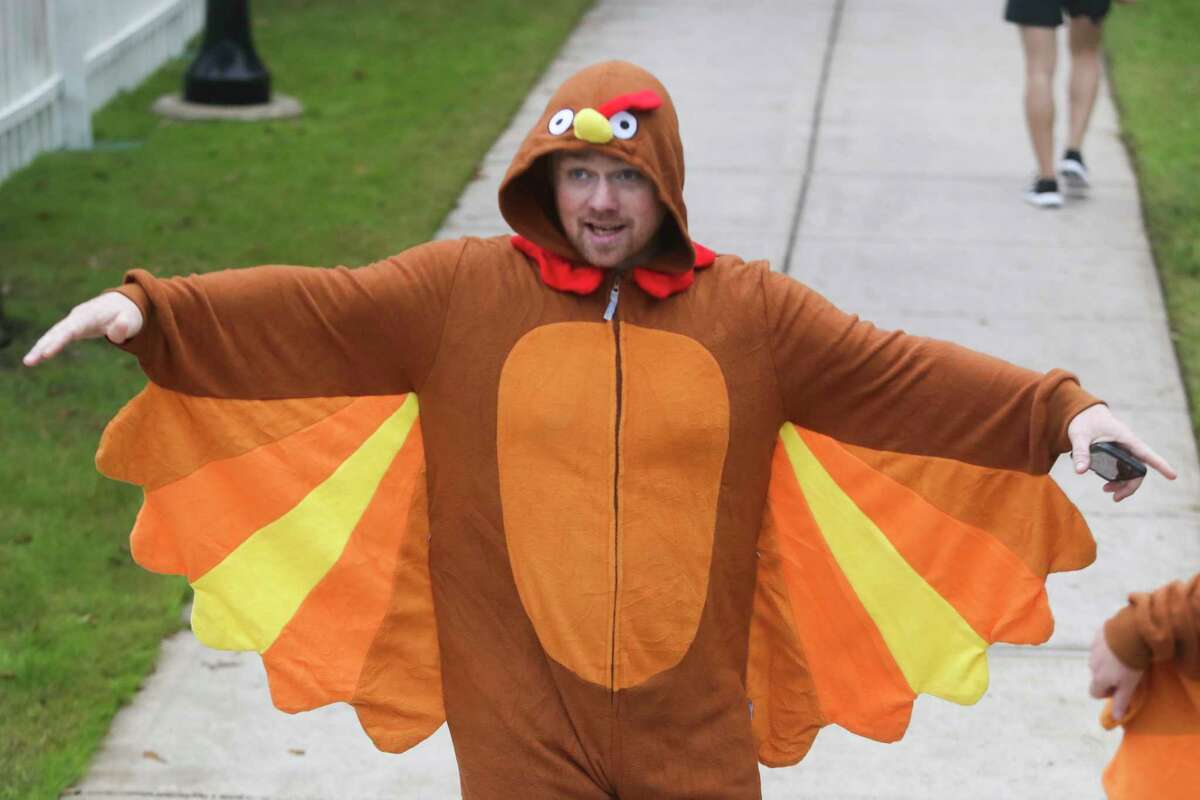 Ian Mcnaughton wears a turkey suit before taking part in the YMCA’s annual Run Thru the Woods race on Thanksgiving Day, Thursday, Nov. 24, 2022, in The Woodlands.