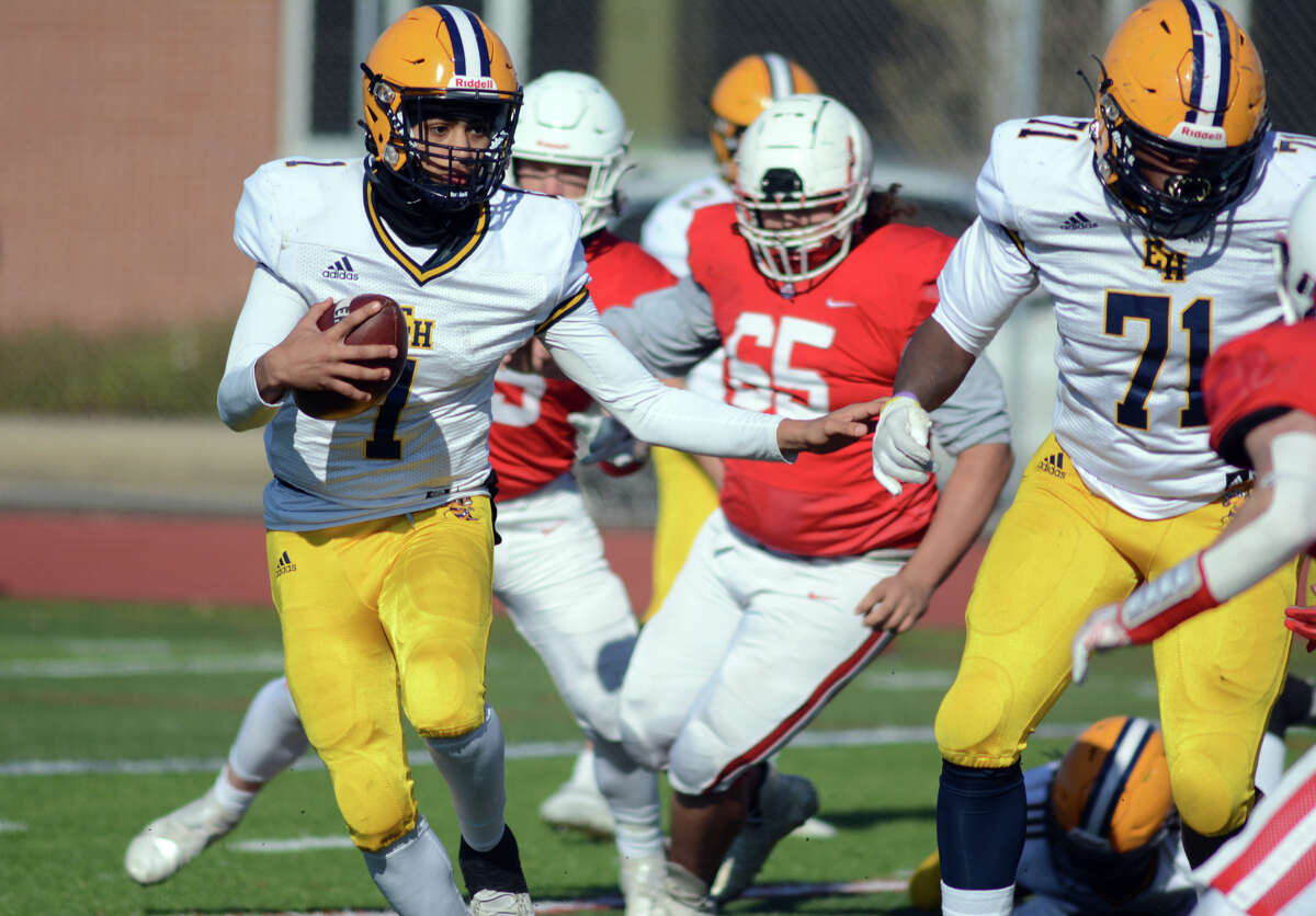 Nick Bilides of East Haven carries the ball for a short gain.