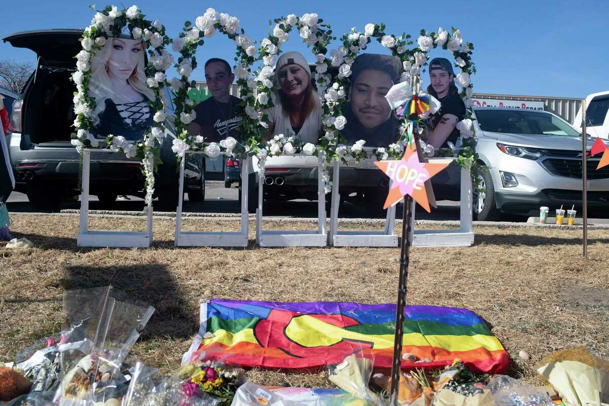 Images of the victims killed in the Club Q shooting are placed along a memorial near Club Q.