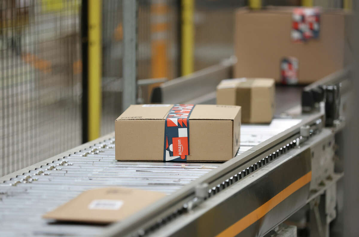 Amazon packages move on a conveyer belt at Rugeley Amazon Fulfilment Centre on November 23, 2022 in Rugeley, England. 