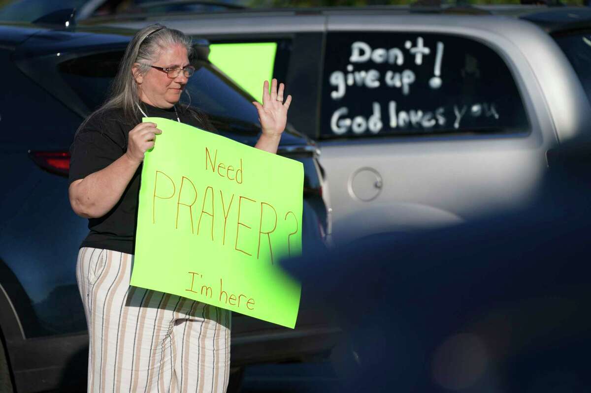 Jeannie Griffith stands Wednesday outside the Chesapeake, Va., Walmart where a gunman killed six people hours earlier.