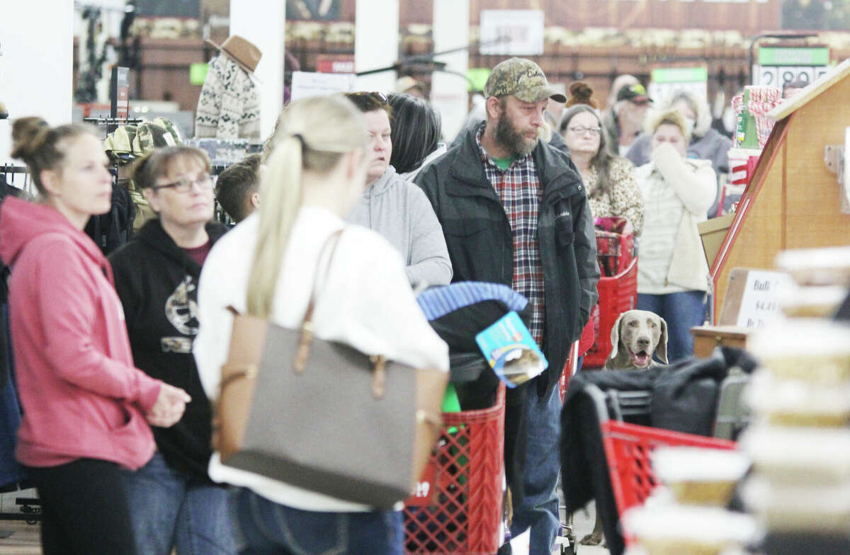 Shoppers wait in a long line to check out at the Alton Farm and Home Supply store early on Black Friday. The National Retail Federation had predicted more than 160 million shoppers would be out that weekend, but actual numbers came in much higher at more than 190 million.