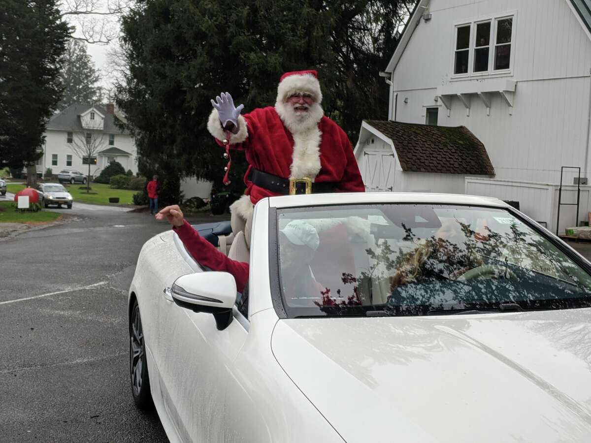 Along with First Selectman Fred Camillo in he car, Santa arrived at Sam Bridge Nursery and Greenhouses on Friday to kick off the annual Reindeer Festival.